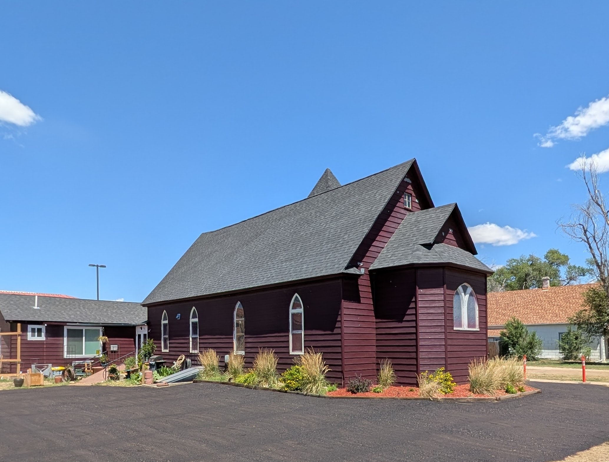 The Old Red Chapel — historic 1909 church interior with stained glass windows in Hugo, Colorado