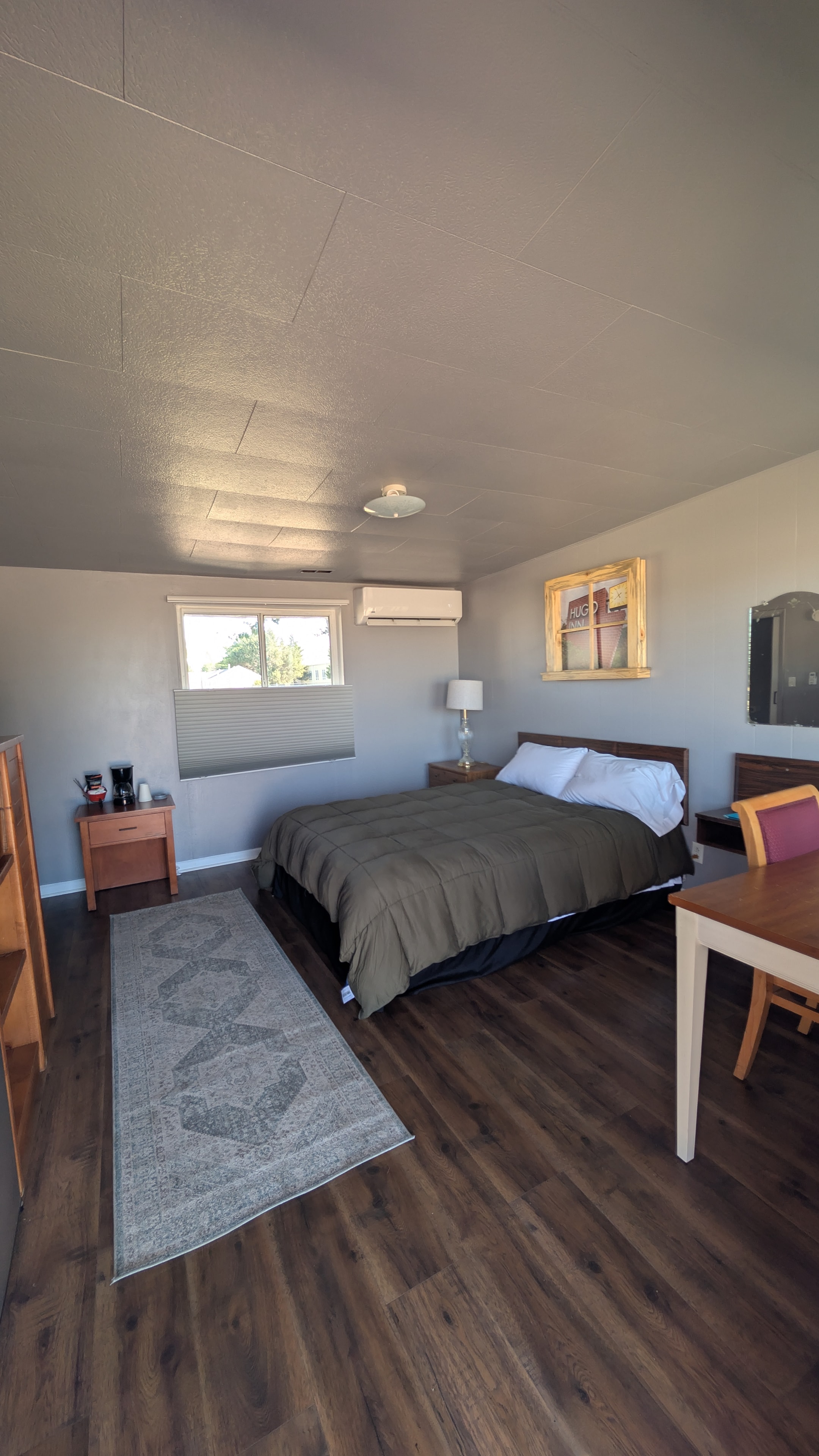 Hugo Inn king room with hardwood floors